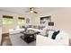 Cozy living space with modern decor, plush seating, and plenty of natural light at 2531 S Hoyt Ct, Lakewood, CO 80227
