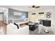 Comfortable living room featuring hardwood floors, modern furniture, and a ceiling fan at 2531 S Hoyt Ct, Lakewood, CO 80227