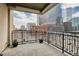 Spacious balcony with stunning city views and decorative planters at 1827 N Grant St # 502, Denver, CO 80203