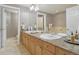 Bathroom featuring double sinks, granite countertops, and a large mirror at 1827 N Grant St # 502, Denver, CO 80203