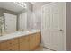 Bathroom with tiled vanity and light wood cabinets at 1827 N Grant St # 502, Denver, CO 80203