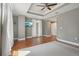 Bedroom with hardwood floors, balcony access, recessed lights, and neutral walls at 1827 N Grant St # 502, Denver, CO 80203