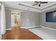 Spacious bedroom with hardwood floors, recessed lighting, ceiling fan, and neutral walls at 1827 N Grant St # 502, Denver, CO 80203