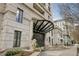 Elegant building entrance featuring stone facade, lion statues, and covered vestibule entry at 1827 N Grant St # 502, Denver, CO 80203