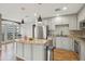 Modern kitchen featuring stainless steel appliances, granite countertops, hardwood floors, and ample cabinet space at 1827 N Grant St # 502, Denver, CO 80203