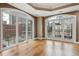 Bright living room with hardwood floors and large windows with city views at 1827 N Grant St # 502, Denver, CO 80203