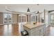 Bright living room with hardwood floors, granite island, fireplace, and balcony access, offering city views at 1827 N Grant St # 502, Denver, CO 80203
