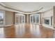 Spacious living room boasting hardwood floors, fireplace, and large windows with city views at 1827 N Grant St # 502, Denver, CO 80203