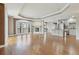 Open-concept living space with hardwood floors, fireplace, and kitchen with granite countertops at 1827 N Grant St # 502, Denver, CO 80203
