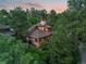 Unique home with a distinctive roof, nestled in a lush, mature forest, offering privacy and natural beauty at 4406 Orofino Pl, Castle Rock, CO 80108