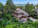 Unique aerial view of a home surrounded by lush greenery and picturesque mountain vistas at 4406 Orofino Pl, Castle Rock, CO 80108