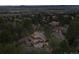A high angle aerial view of a neighborhood offering beautiful rooftops amongst mature tree coverage at 4406 Orofino Pl, Castle Rock, CO 80108