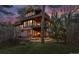 Beautiful multi-story home featuring a deck, large windows, and a picturesque outdoor space surrounded by mature trees at 4406 Orofino Pl, Castle Rock, CO 80108