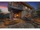 Outdoor patio with stone pathway, landscape lighting, and covered deck space, great for relaxing and entertaining at 4406 Orofino Pl, Castle Rock, CO 80108