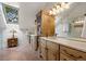 Bright bathroom featuring double vanities, and a walk-in shower at 4406 Orofino Pl, Castle Rock, CO 80108