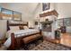 Elegant main bedroom with a fireplace, sitting area, and large windows at 4406 Orofino Pl, Castle Rock, CO 80108