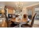 Cozy dining area with a fireplace, round table, and access to an outdoor balcony, perfect for intimate gatherings at 4406 Orofino Pl, Castle Rock, CO 80108