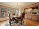 Elegant dining room with a round table, chandelier, and natural wood accents, ideal for entertaining guests at 4406 Orofino Pl, Castle Rock, CO 80108