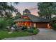Stunning home featuring a unique roof design, lush landscaping, and a welcoming entrance with a cozy seating area at 4406 Orofino Pl, Castle Rock, CO 80108