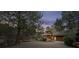 Charming house with a unique shingled roof, lush trees, and a circular driveway at 4406 Orofino Pl, Castle Rock, CO 80108