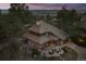 Aerial view of a unique home with a striking roof design, beautiful landscaping, and a serene natural setting at 4406 Orofino Pl, Castle Rock, CO 80108
