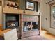 Charming brick fireplace with glass doors, adding warmth and character to the cozy living space at 4406 Orofino Pl, Castle Rock, CO 80108