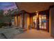 Inviting covered front entry featuring double doors, brick accents, unique architectural details and stone pathway at 4406 Orofino Pl, Castle Rock, CO 80108