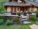 Charming patio area with stone accents, comfortable seating, and beautiful landscaping, perfect for outdoor relaxation at 4406 Orofino Pl, Castle Rock, CO 80108