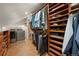 Organized walk-in closet features built-in shelving, cabinets, and laundry machines at 4406 Orofino Pl, Castle Rock, CO 80108