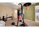 Finished basement with gym equipment and neutral carpeting at 12337 2Nd St, Parker, CO 80134