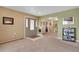 Inviting entryway featuring a multi-paneled front door and view to carpeted living space at 12337 2Nd St, Parker, CO 80134