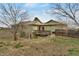 Exterior rear view of house with a wooden deck and stair access at 12337 2Nd St, Parker, CO 80134