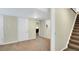 The hallway features carpet flooring and doorways with white trim at 12337 2Nd St, Parker, CO 80134