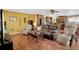 Open-concept living area with hardwood floors, comfortable seating, and lots of natural light at 12337 2Nd St, Parker, CO 80134