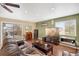 Comfortable living room with hardwood floors, a TV, and sliding glass doors at 12337 2Nd St, Parker, CO 80134