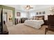 Inviting main bedroom featuring a ceiling fan, and a decorative fireplace at 12337 2Nd St, Parker, CO 80134