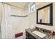 Well-lit bathroom featuring a shower-tub combo, updated vanity with granite countertop, and window for natural light at 2838 Cascade Creek Dr, Lafayette, CO 80026