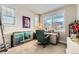 Bedroom with a large window, desk, and comfortable chair perfect for a home office at 2838 Cascade Creek Dr, Lafayette, CO 80026