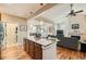 Open concept kitchen with island featuring granite countertops, with access to the living room and dining area at 2838 Cascade Creek Dr, Lafayette, CO 80026