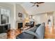 Bright living room features vaulted ceilings, fireplace, wood floors and neutral paint at 2838 Cascade Creek Dr, Lafayette, CO 80026
