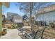 Cozy patio with seating area, surrounded by a wooden fence and mature landscaping at 2838 Cascade Creek Dr, Lafayette, CO 80026