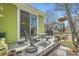 Outdoor patio with seating, overlooking a fenced yard and adjacent homes at 2838 Cascade Creek Dr, Lafayette, CO 80026