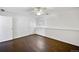 Bright bedroom features wood floors, neutral walls, ceiling fan, and a window at 7346 S Xenia Cir # A, Centennial, CO 80112