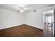 Bright bedroom features wood floors, neutral walls, ceiling fan, and walk-in closet for ample storage at 7346 S Xenia Cir # A, Centennial, CO 80112