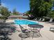 Community pool with chairs, tables, and inviting blue waters, for relaxation and recreation at 7346 S Xenia Cir # A, Centennial, CO 80112