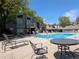 Community pool with lounge chairs, tables, and seating for residents to enjoy at 7346 S Xenia Cir # A, Centennial, CO 80112
