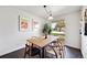 Well-lit dining room featuring modern decor, a sleek wooden table, and an outdoor view at 7346 S Xenia Cir # A, Centennial, CO 80112