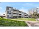 Exterior view of multi-story home featuring large balconies and manicured lawn at 7346 S Xenia Cir # A, Centennial, CO 80112