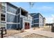 Attractive blue and white two-story home featuring landscaped yard and walkway to the front door at 7346 S Xenia Cir # A, Centennial, CO 80112
