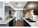 Contemporary kitchen equipped with stainless steel appliances, sleek cabinetry, and hardwood floors at 7346 S Xenia Cir # A, Centennial, CO 80112